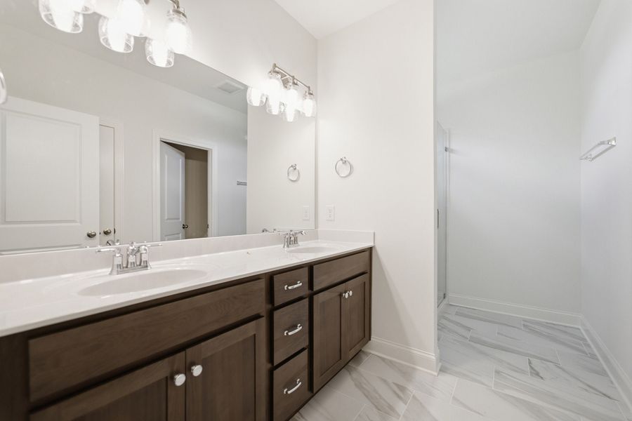 Furnished interior view inside a new home in Aden Woods, Fairview (Image 11).