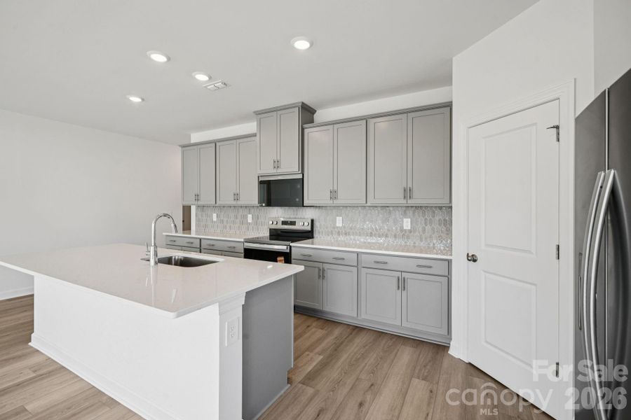 Photo is not of the actual home, but is an inspirational photo of builder’s model home and may depict options, furnishings, and/or decorator features that are not included