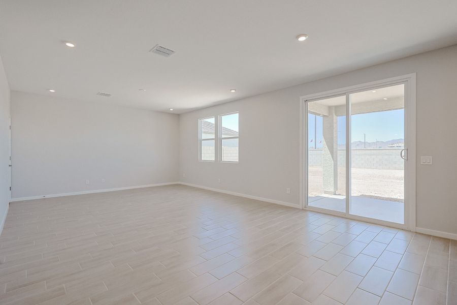 A room with a glass door and a wood floor. A room with a glass door and a wood floor.