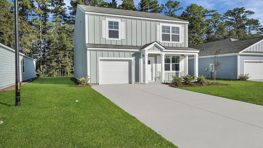 Front exterior of a new home in Hillcrest, Ravenel, SC, highlighting curb appeal (Image 20).