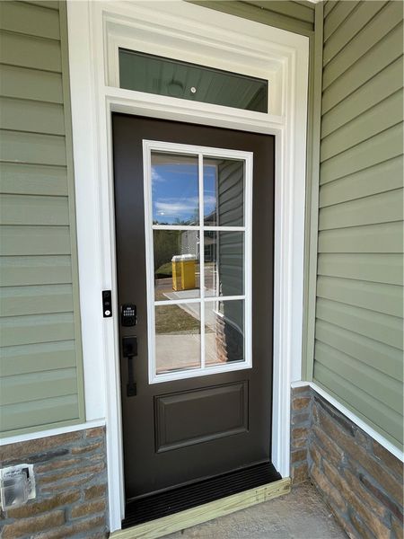 The home features an inviting entrance with smart
