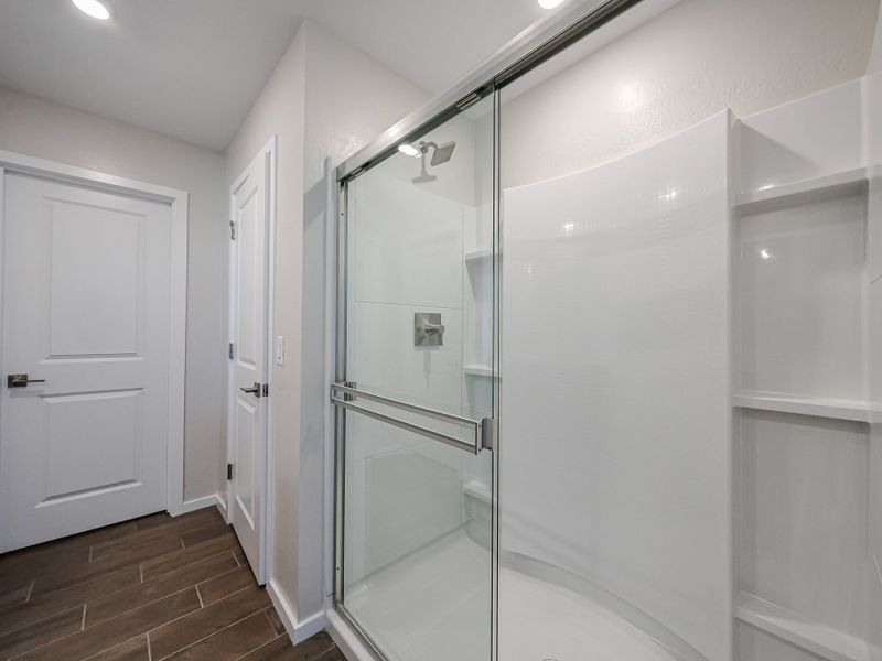 A shower unit in a bathroom.