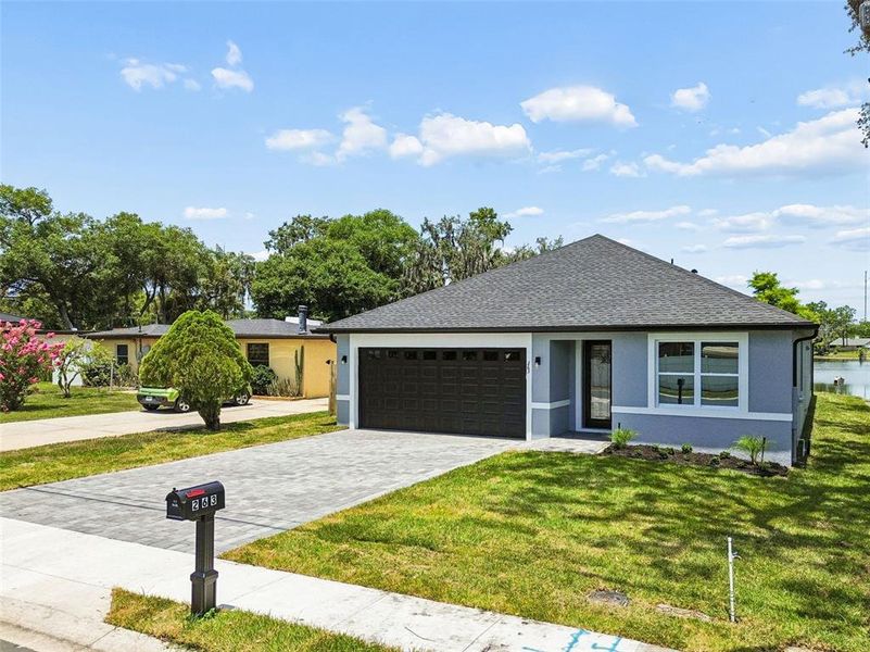 Front exterior of a new home in , Casselberry, FL, highlighting curb appeal (Image 24). Front exterior of a new home in , Casselberry, FL, highlighting curb appeal (Image 24).