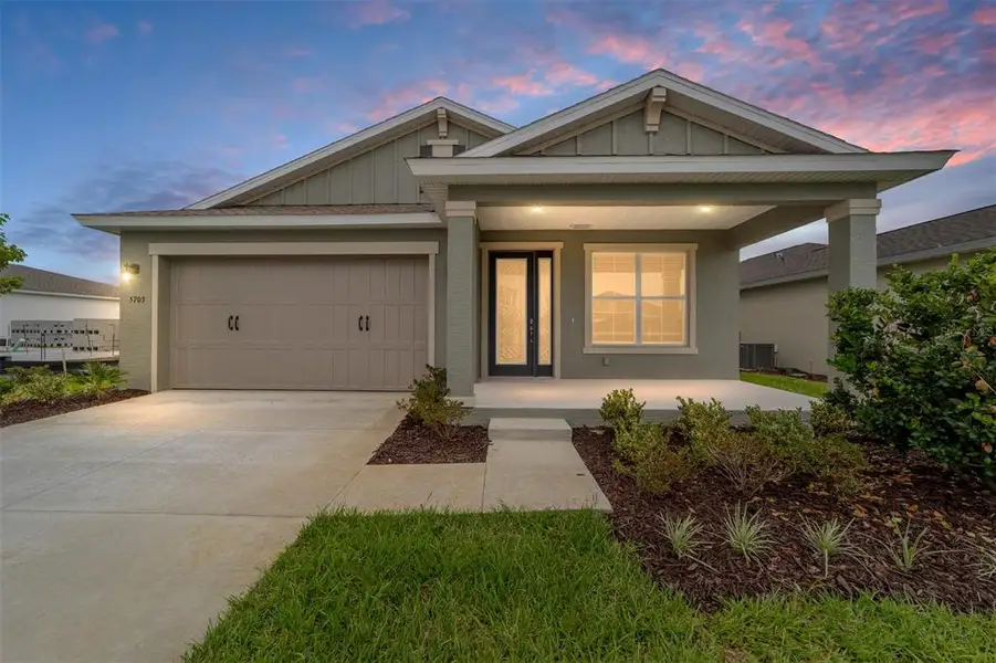 Front exterior of a new home in Calesa Township, Ocala, FL, highlighting curb appeal (Image 1). Front exterior of a new home in Calesa Township, Ocala, FL, highlighting curb appeal (Image 1).