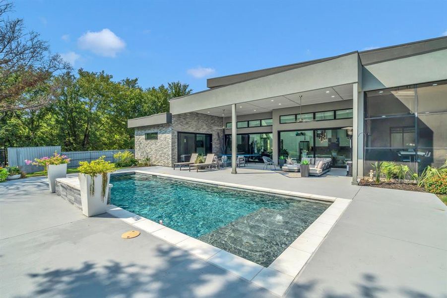 View of pool featuring a patio and an outdoor hangout area