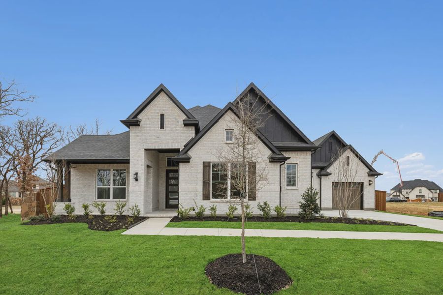 Representative exterior photo of a completed home built from the Tirana by Chesmar Homes in Canyon Falls, Argyle, TX (Image 1). Representative exterior photo of a completed home built from the Tirana by Chesmar Homes in Canyon Falls, Argyle, TX (Image 1).