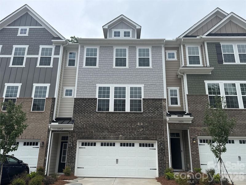 Front exterior of a new home in Village of Waxhaw, Waxhaw, NC, highlighting curb appeal (Image 2).