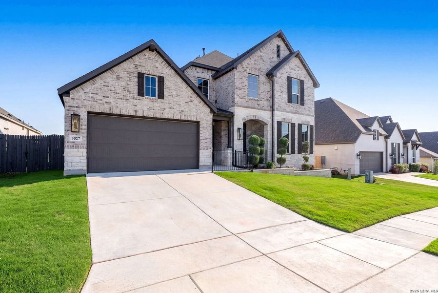 Front exterior of a new home in Ventana, Bulverde, TX, highlighting curb appeal (Image 28).