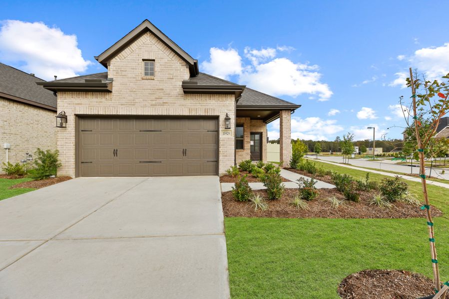 Front exterior of a new home in Wood Leaf Reserve, Tomball, TX, highlighting curb appeal (Image 18).