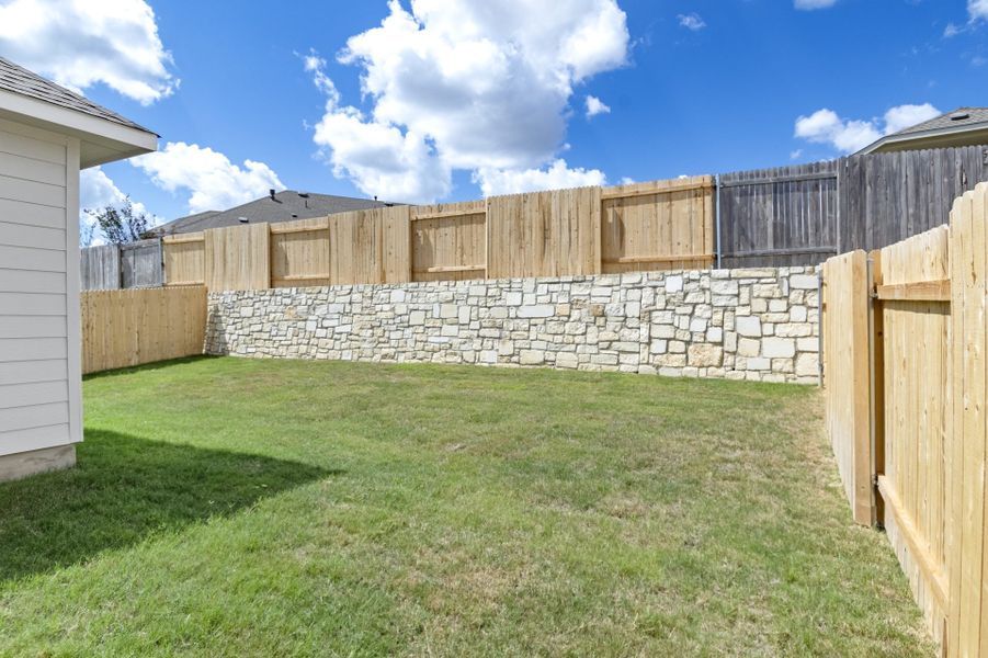 Exterior details and patio area of a home in Crosswinds, Kyle (Image 25).