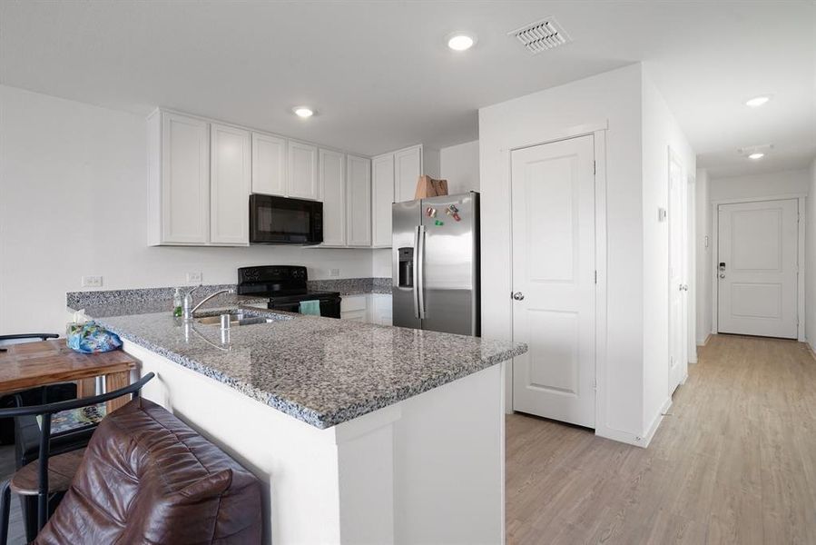 Furnished interior view inside a new home in Tillage Farms, Princeton (Image 8).