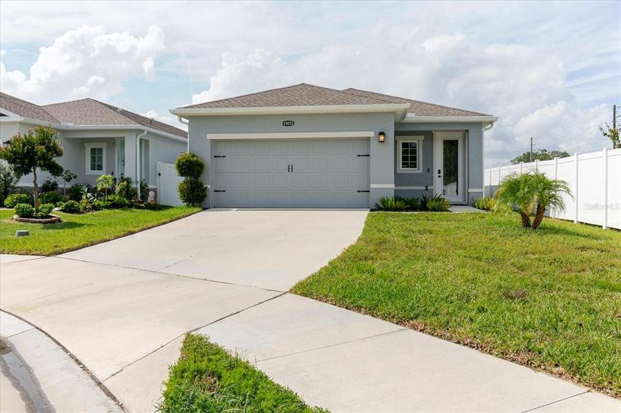 Front exterior of a new home in Conner Crossing, Spring Hill, FL, highlighting curb appeal (Image 23).