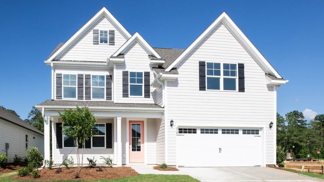 Front exterior of a new home in Indigo Preserve, Leland, NC, highlighting curb appeal (Image 1). Front exterior of a new home in Indigo Preserve, Leland, NC, highlighting curb appeal (Image 1).