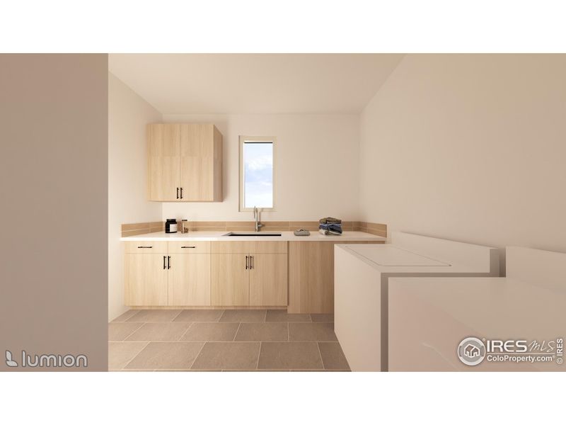 Laundry Room With A Large Window, Cabinets & A Large SS Laundry Sink