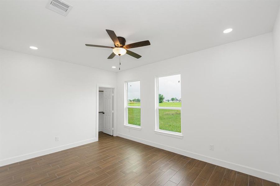 5th Bedroom/Gameroom with recessed lighting, ceiling fan, tile flooring, and oversized windows to exude natural lighting.