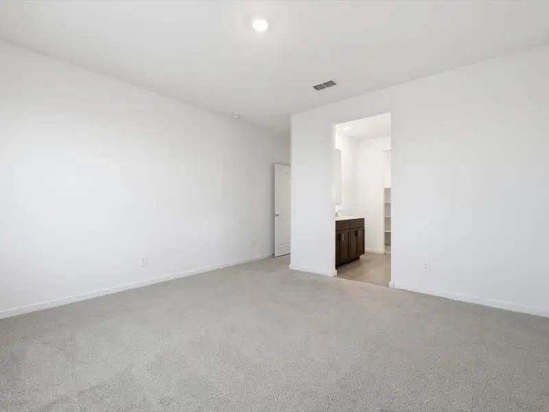 Spacious, unfurnished interior of a new home in Rancho Mirage Estate Series, Maricopa (Image 11).