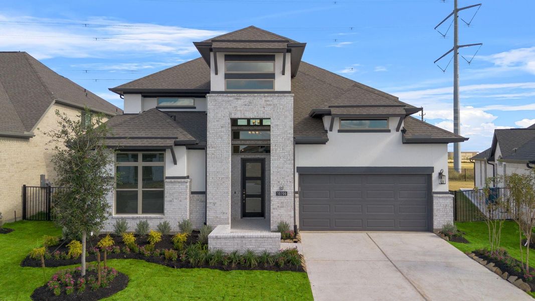 Front exterior of a new home in Bridgeland 55', Cypress, TX, highlighting curb appeal (Image 22).