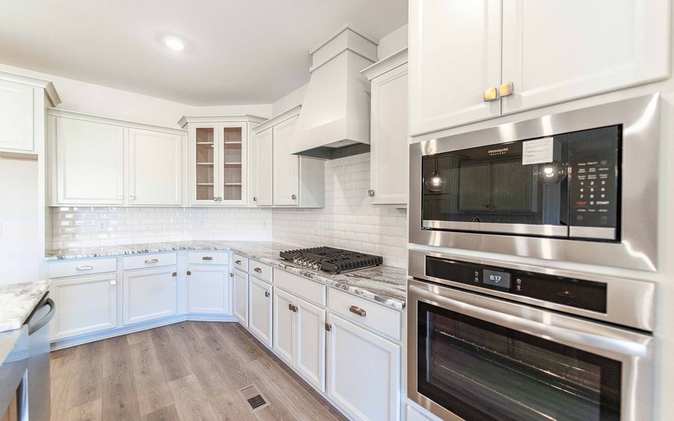Furnished interior view inside a new home in Aden Woods, Fairview (Image 6).