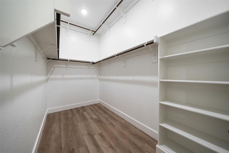 Walk in closet featuring wood finished floors