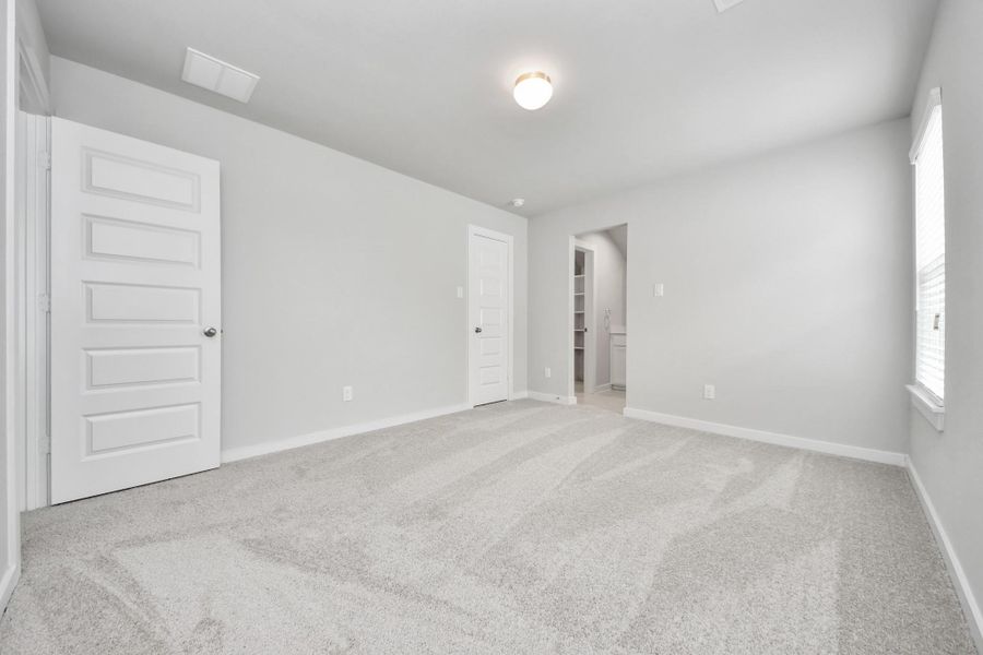 Generously sized secondary bedrooms featuring spacious closets, soft and inviting carpeting underfoot, large windows allowing plenty of natural light, and the added touch of privacy blinds for your personal retreat. Sample photo of completed home with similar floor plan. Actual colors and selections may vary. Generously sized secondary bedrooms featuring spacious closets, soft and inviting carpeting underfoot, large windows allowing plenty of natural light, and the added touch of privacy blinds for your personal retreat. Sample photo of completed home with similar floor plan. Actual colors and selections may vary.