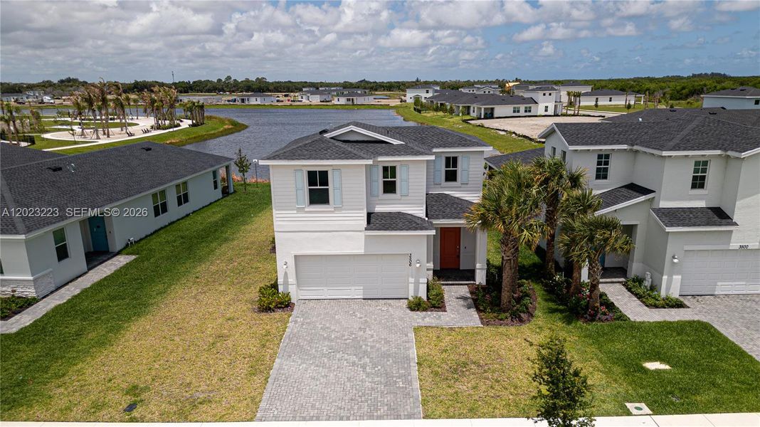 Front exterior of a new home in Seagrove, Fort Pierce, FL, highlighting curb appeal (Image 25). Front exterior of a new home in Seagrove, Fort Pierce, FL, highlighting curb appeal (Image 25).