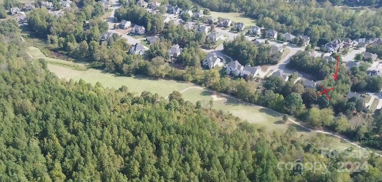 Lot sits across Snyder Creek and looks out to hole #4 and the cart pat to hole #5