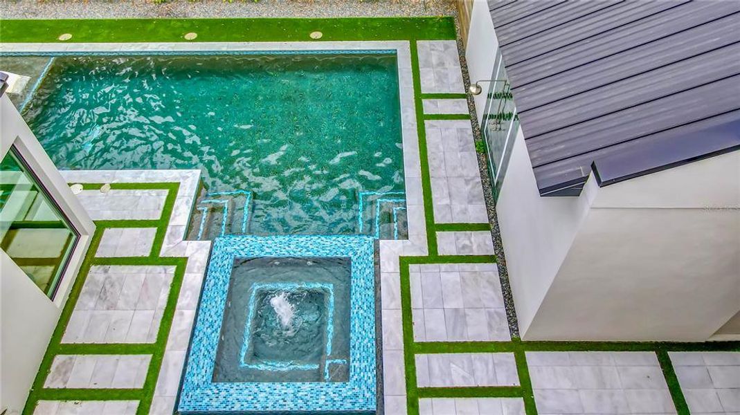 View from Second Level Balcony to Swimming Pool and Spa Below