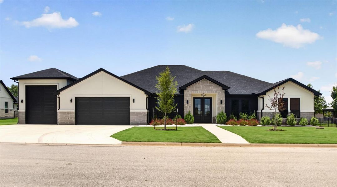 Front exterior of a new home in , Kingsland, TX, highlighting curb appeal (Image 23).