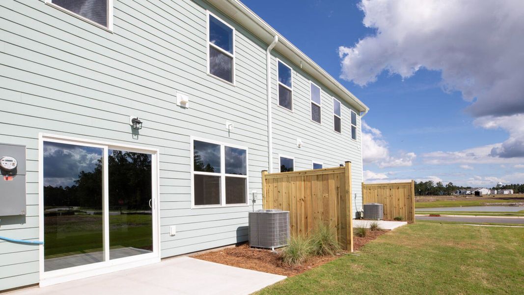 Exterior details and patio area of a home in Indigo Preserve Townhomes, Leland (Image 20).