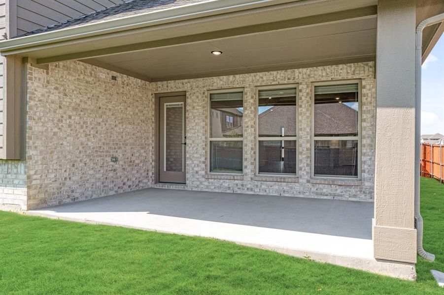 Exterior details and patio area of a home in Timberbrook 3B-4A, Justin (Image 16).