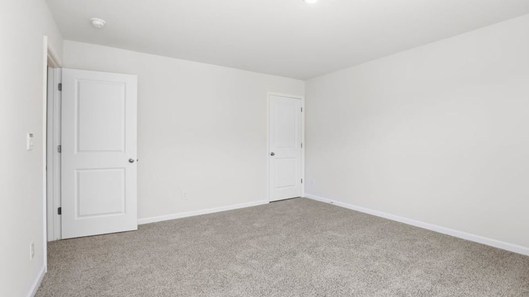 Spacious, unfurnished interior of a new home in Durbin Meadows Traditions, Fountain Inn (Image 32).