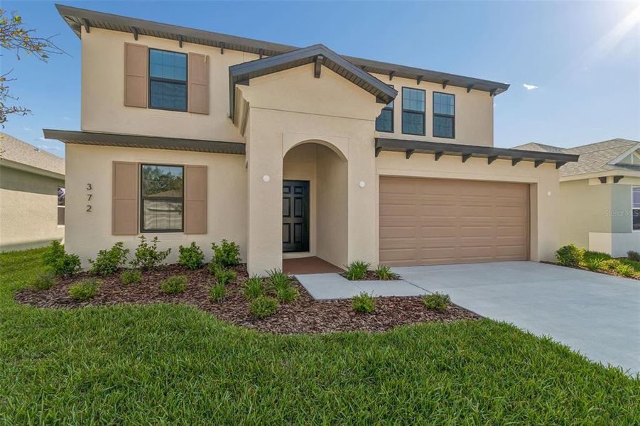 Front exterior of a new home in Avalon West, Spring Hill, FL, highlighting curb appeal (Image 32).