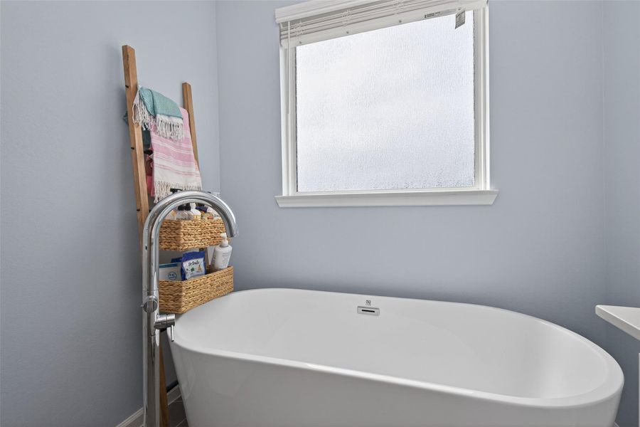 Spacious soaking tub area designed for comfort and relaxation