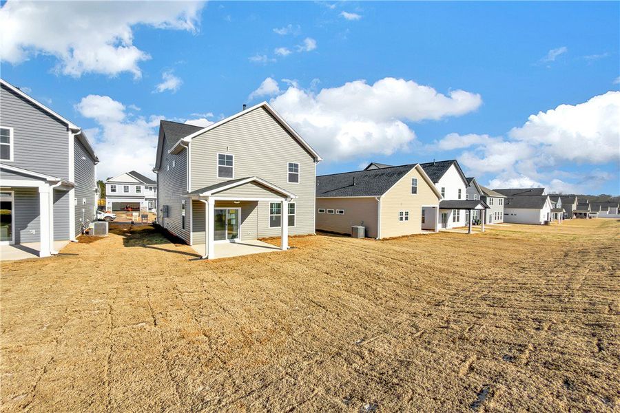 Exterior details and patio area of a home in Brownstone Park, Easley (Image 16).