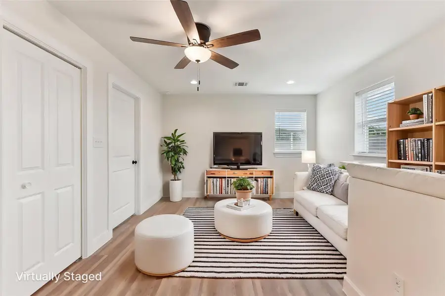 Virtually Staged upstairs Family Area featuring recessed lighting, wood finished floors, visible vents, baseboards, and ceiling fan