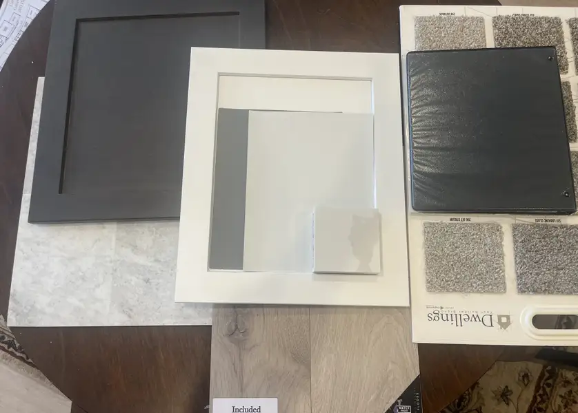 Beautiful laminate (Borneo by Dwellings) Jet Stream silver carpet, Kitchen cabinets Shaker White and large island and bathroom cabinets are Shaker Graphite. Blended color LVT in bathrooms and laundry. Walls are pale grey/white and a drk gry in GR,D,K