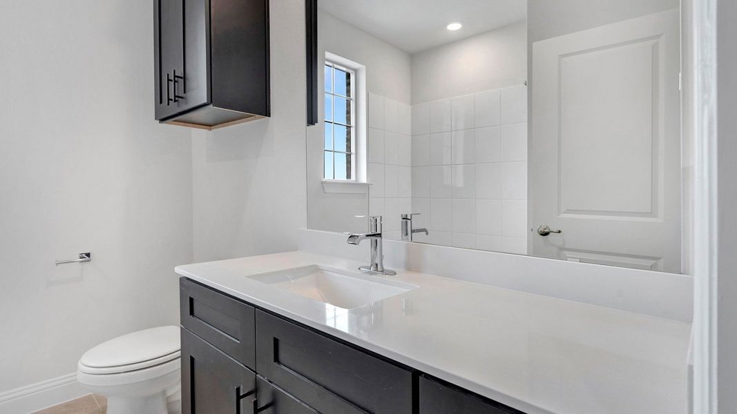 Representative furnished interior of a home built from the Derby by D.R. Horton in Mustang Square, Plano (Image 11).