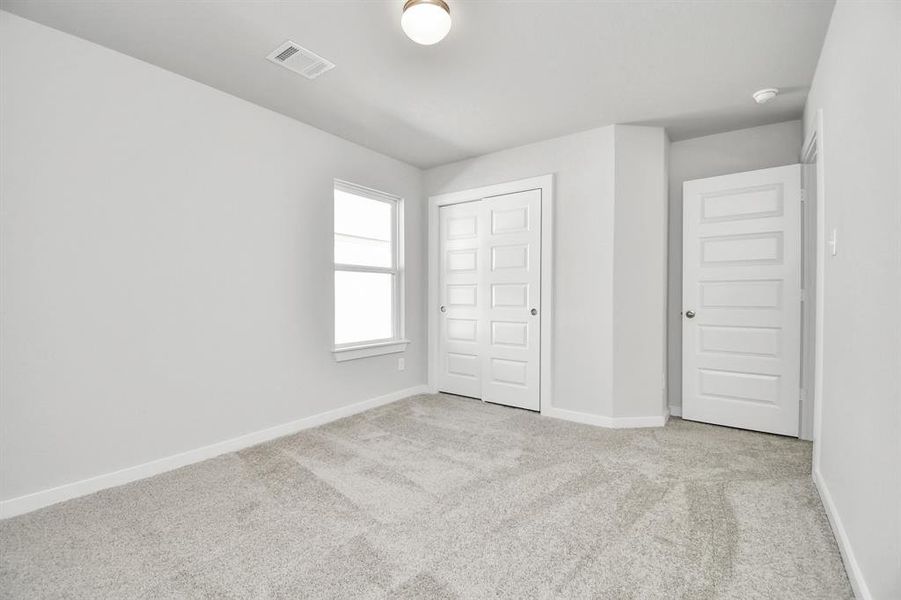 Generously sized secondary bedrooms, complete with spacious closets and soft, inviting carpeting. Enjoy abundant natural light streaming in through the large windows, complemented by privacy blinds for your personal sanctuary.