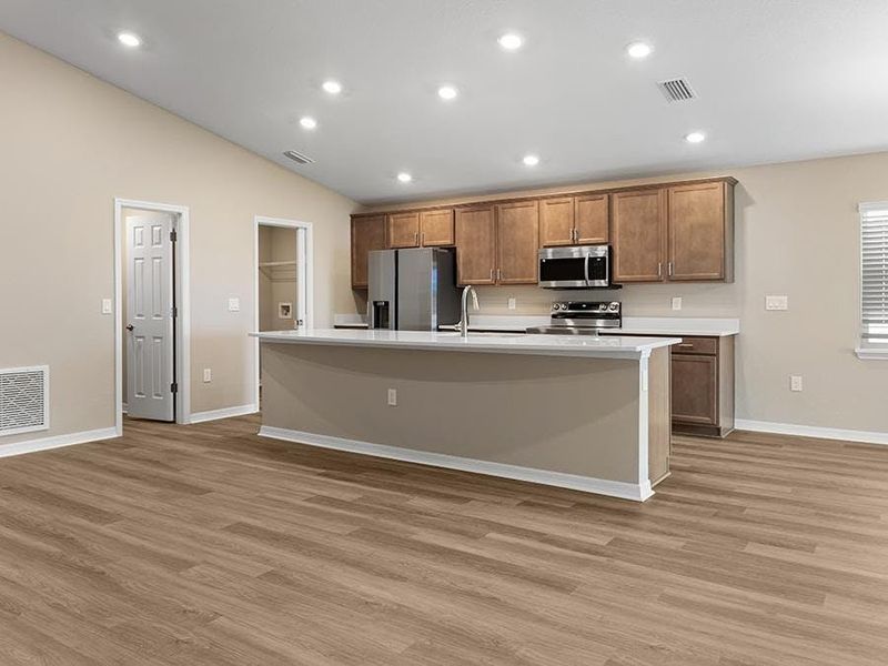 Inside, the bright and open living area is finished with luxury vinyl plank flooring.