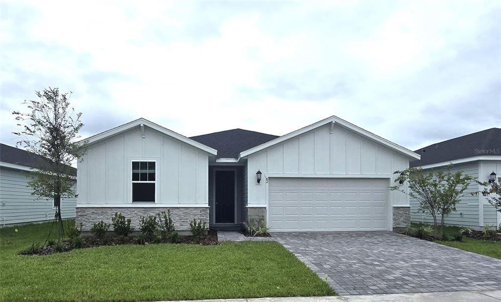 Front exterior of a new home in Colbert Landings, Palm Coast, FL, highlighting curb appeal (Image 16).