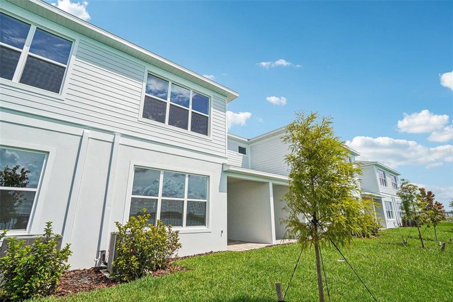 Front exterior of a new home in Isla Mirada, San Antonio, FL, highlighting curb appeal (Image 27).