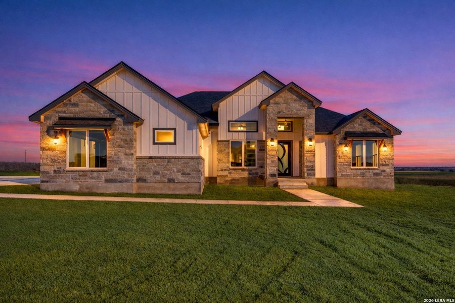 Front exterior of a new home in , La Vernia, TX, highlighting curb appeal (Image 2). Front exterior of a new home in , La Vernia, TX, highlighting curb appeal (Image 2).