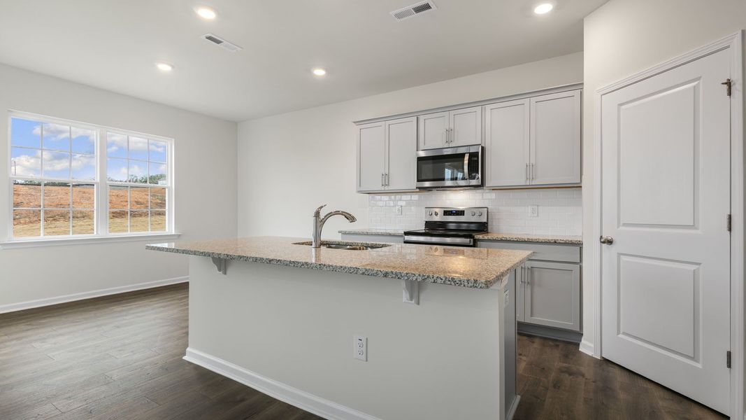 Furnished interior view inside a new home in The Grove at Matthews Landing, Fuquay Varina (Image 7).