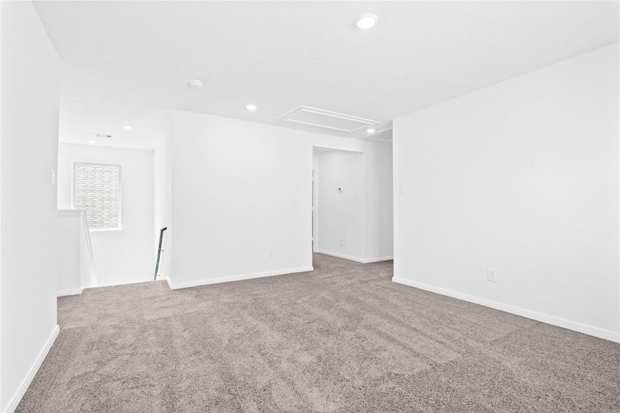 Additional view from the Loft, showcasing the staircase and hallway leading to the bedrooms and bathrooms.