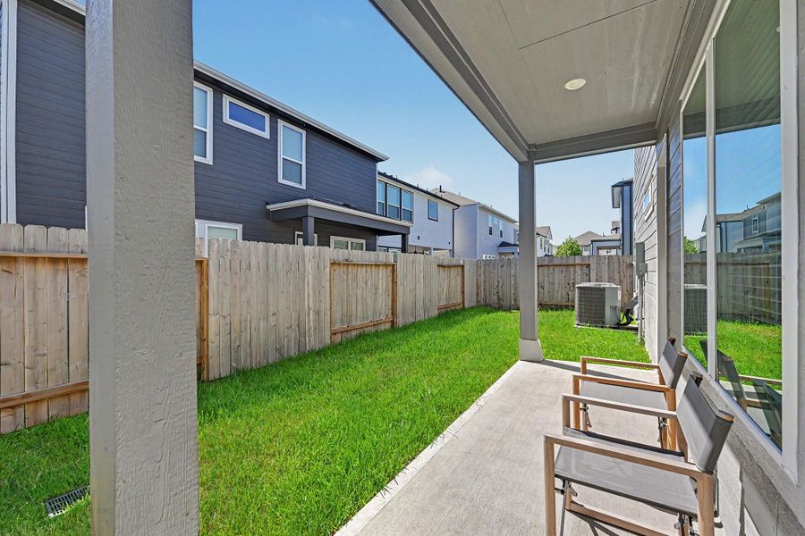 From the patio, enjoy views of the backyard and blue skies above. From the patio, enjoy views of the backyard and blue skies above.