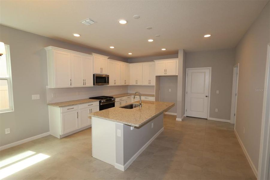 Furnished interior view inside a new home in Center Lake on the Park, St. Cloud (Image 10).