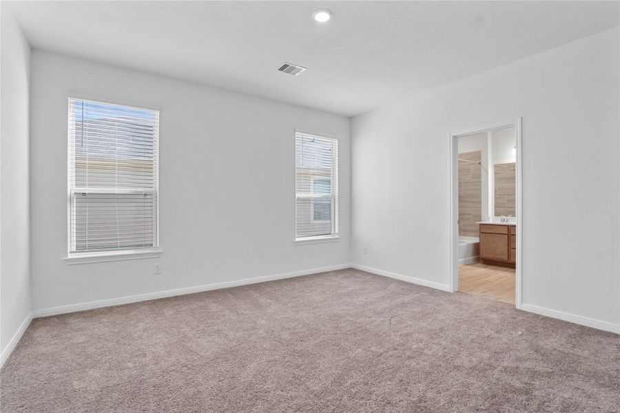 Unwind in your private sanctuary. This tranquil primary suite is a true retreat, offering a sense of calm and luxury. With a spacious layout, walk-in closet, and en-suite bath, it's the perfect place to start and end your day. Unwind in your private sanctuary. This tranquil primary suite is a true retreat, offering a sense of calm and luxury. With a spacious layout, walk-in closet, and en-suite bath, it's the perfect place to start and end your day.