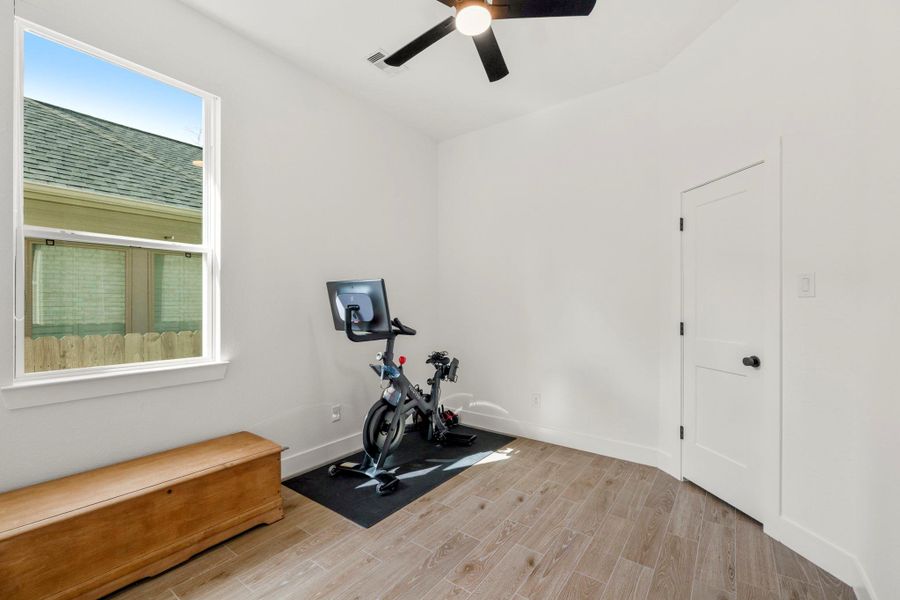 Another bright and airy secondary bedroom featuring natural light, a ceiling fan, and elegant tile flooring. Another bright and airy secondary bedroom featuring natural light, a ceiling fan, and elegant tile flooring.