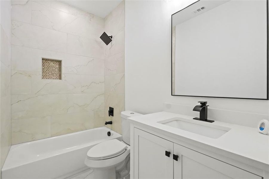 Full bath featuring vanity and bathing tub / shower combination