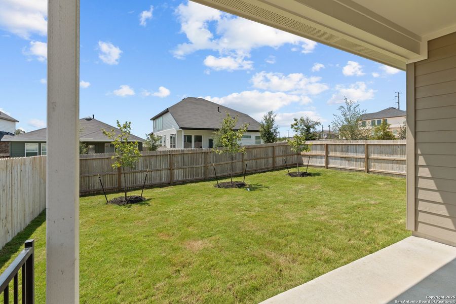 Front exterior of a new home in Hunters Ranch, San Antonio, TX, highlighting curb appeal (Image 26). Front exterior of a new home in Hunters Ranch, San Antonio, TX, highlighting curb appeal (Image 26).